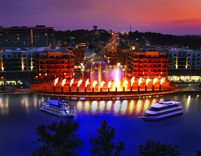 Branson Landing fountain show at sunset on Lake Taneycomo in Branson, Missouri.