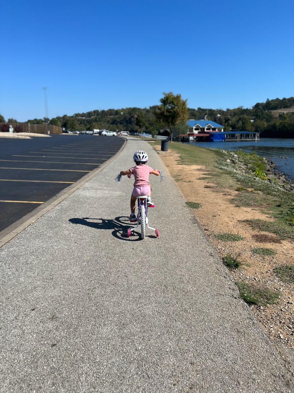 Riding bike by lake taneycomo in branson, mo